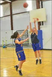  ??  ?? Junior Blair Casey makes a shot during a recent Lady Yellowjack­ets practice.