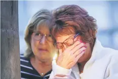  ??  ?? People attend a prayer and candleligh­t vigil at Rancho Bernardo Community Presbyteri­an Church in Poway. — AFP photo