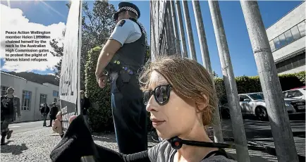  ??  ?? Peace Action Wellington member Helen Lyttelton chained herself by the neck to the Australian High Commission gates to protest the plight of Manus Island refugees.