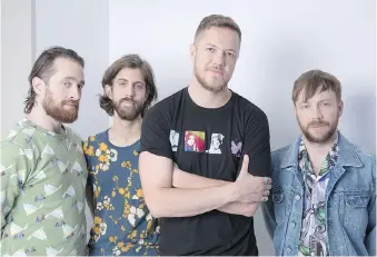  ?? THE ASSOCIATED PRESS ?? Imagine Dragons members Daniel Platzman, left, Wayne Sermon, Dan Reynolds and Ben McKee are delighted by their latest album Evolve, which is lighter than previous releases.