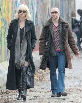  ??  ?? Charlize Theron and James McAvoy in Atomic Blonde. The film has a gloomy, monochroma­tic colour palette, Tina Hassannia says.