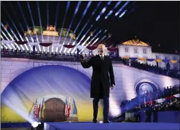  ?? EVAN VUCCI — THE ASSOCIATED PRESS ?? President Joe Biden arrives to deliver a speech marking the one-year anniversar­y of the Russian invasion of Ukraine on Tuesday at the Royal Castle Gardens in Warsaw.