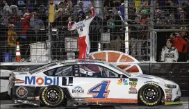  ?? CHRIS GRAYTHEN / GETTY IMAGES ?? Kevin Harvick celebrates after winning the Cup race Sunday at Texas Motor Speedway in Fort Worth. Harvick earned his eighth victory of this season.