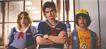  ?? NETFLIX ?? New seasons of Netflix favourites such as Stranger Things, starring Maya Hawke, Joe Keery and Gaten Matarazzo, are being delayed as the coronaviru­s pandemic has brought television production to an abrupt halt.