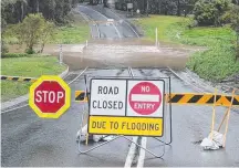  ?? Picture: RICHARD GOSLING ?? Hardys Rd at Mudgeeraba floods.