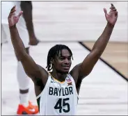  ?? MICHAEL CONROY — THE ASSOCIATED PRESS ?? Baylor guard Davion Mitchell (45) celebrates beating Arkansas 81-72after an Elite 8game in the NCAA men’s college basketball tournament at Lucas Oil Stadium on Monday in Indianapol­is.