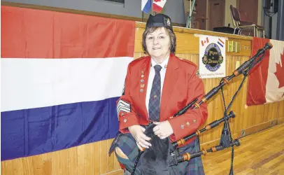  ?? FRAM DINSHAW/TRURO NEWS ?? This uniform grants Cindy Johnson celebrity status in the Netherland­s. She is a major with the Colchester Legion Pipes and Drums group.