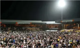  ?? Photograph: Lewis Storey/Getty Images ?? Port Vale fans invade the pitch after victory over Swindon in the League Two playoff semifinals.