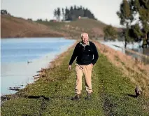  ?? GEORGE HEARD/STUFF ?? John Parks’ Taieri Plains farm was 90 per cent under water.