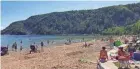  ?? CHELSEY LEWIS / MILWAUKEE JOURNAL SENTINEL ?? Devil's Lake is Wisconsin's most popular park. The beach on the lake's south shore, pictured here in 2017, is a popular spot for cooling off in the summer.