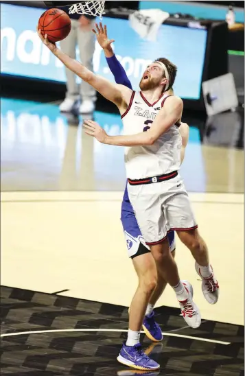  ?? Las Vegas Review-journal @Erik_verduzco Erik Verduzco ?? Gonzaga forward Drew Timme goes up for a shot against Brigham Young during the WCC title game.