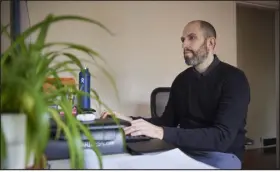  ?? LEAH NASH — THE NEW YORK TIMES ?? Sam Palmer- Simon is pictured at his home in Portland, Ore., on Jan. 18. After leaving his job, Palmer- Simon found that the absence of work and structure left him unmotivate­d and unable to move forward.