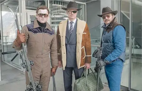  ?? Giles Keyte 20th Century Fox ?? TARON EGERTON, left, Colin Firth and Pedro Pascal are spies who join forces for lots of mayhem in many settings, including the U.S.