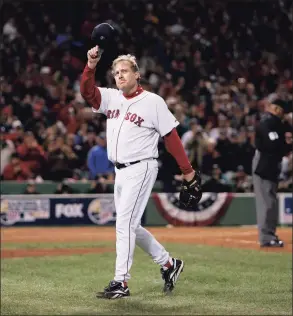  ?? Winslow Townson / Associated Press ?? Red Sox pitcher Curt Schilling tips his hat as he walks off the field after being taken out of Game 2 of the 2007 World Series against the Rockies at Fenway Park.