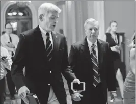  ?? ASSOCIATED PRESS ?? IN THIS JULY 13 FILE PHOTO, SEN. BILL CASSIDY, R-LA. (left), and Sen. Lindsey Graham, R-S.C., talk while walking to a meeting on Capitol Hill in Washington.