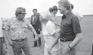  ?? Associated Press ?? Billy Carter, left, mother Lillian Carter and President Jimmy Carter enjoy a family joke prior to the president’s departure from Plains, Georgia, May 31, 1977. Now, generation­s later, his family is rallying around him for the private final chapter of his 98 years.