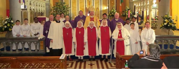  ??  ?? Sr. Peter and members of the Adoration Sisters on the altar with Bishop Denis Brennan and clergy at the special Mass to mark the departure of the Sisters.