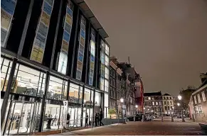  ?? AP ?? An exterior view shows the renovated Anne Frank House Museum, left, in Amsterdam.