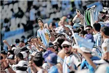  ?? | Reuters ?? AN Argentina fan displays a Diego Maradona cardboard cut-out in the stands before their match against Saudi Arabia.