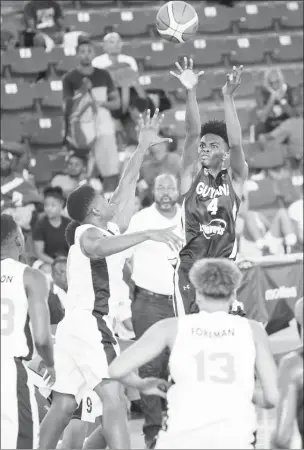  ??  ?? Kevon Wiggins of Guyana attempting a jump shot against Jamaica during their matchup in the Central America &amp; Caribbean Basketball Championsh­ips (CentroBask­et) U17 Tournament.