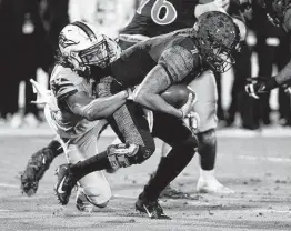  ?? Richard Rodriguez / Getty Images ?? UTSA’s Jamal Ligon tries to sack San Diego State quarterbac­k during the first quarter of Tuesday’s Frisco Bowl. The Roadrunner­s’ season ends at 12-2.