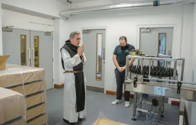  ?? ANDREW TESTA/THE NEW YORK TIMES ?? Father Joseph Delargy says a morning blessing June 27 at Tynt Meadow brewery in Coalville, England.