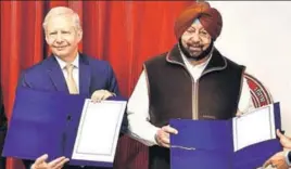  ?? HT PHOTO ?? Punjab CM Captain Amarinder Singh with US ambassador Kenneth I Juster during the signing of the MoU at his residence in Chandigarh on Monday.