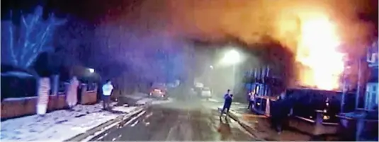  ??  ?? Devastatin­g: Fire service footage of officers arriving at the scene of arson attack which killed the four children in Walkden