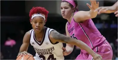  ?? (Photo by Sanford Myers, AP) ?? Mississipp­i State guard Jordan Danberry, left, dribbles around Vanderbit guard Kaleigh Clemons-Green on Thursday night.