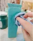  ??  ?? Using a crumpled rag and very little paint — dab the exterior of your glass vase or jar in layers until the entire surface is coated.