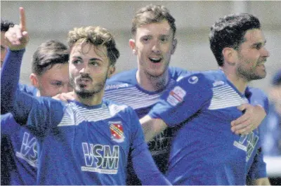  ??  ?? Henry Jones (front) and Brayden Shaw (centre) scored Bangor’s goals at Ton Pentre