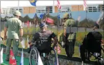  ?? KRISTI GARABRANDT — THE NEWS-HERALD ?? Vietnam veterans: John Blechschmi­d and Tom Walton visit The Moving Wall looking for names of people they know.