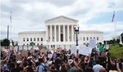  ?? STEFANI REYNOLDS/AFP VIA GETTY IMAGES ?? Abortion rights activists react outside the U.S. Supreme Court after the overturnin­g of Roe v. Wade.