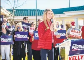  ??  ?? SEN. KELLY LOEFFLER ( R- Ga.) campaigns at Augusta Regional Airport in Augusta, Ga. Loeff ler is being challenged by Democratic candidate Warnock.