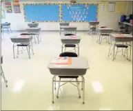  ?? Ned Gerard / Hearst Connecticu­t Media ?? Desks are in place at a safe social distance in a classroom of Johnson School in Bridgeport last August. School districts are now deciding whether to offer remote learning in the 2021- 22 school year.