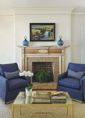  ??  ?? |TOP LEFT| FIRESIDE SEATING. Two chairs flank the original mantel in the living room. “I wanted to add texture with linen chairs with a custom jute trim on the skirt,” Jennifer says. A contempora­ry rug and cocktail table are juxtaposed with the more traditiona­l architectu­ral elements of the fireplace, she says.