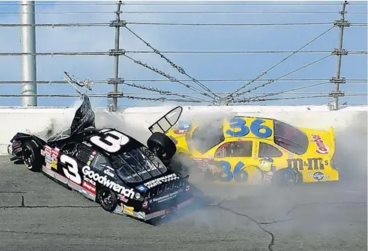  ?? JACOB LANGSTON/ORLANDO SENTINEL ?? Dale Earnhardt (3) crashes into the wall in Turn 4, in front of the car of Ken Schrader on the last lap of the 2001 Daytona 500. Earnhardt, a seven-time NASCAR Cup champion, died at the age of 49.