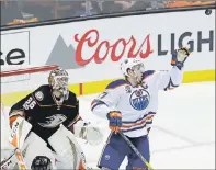  ?? AP PHOTO ?? Edmonton Oilers centre Connor McDavid jumps for the puck as Anaheim Ducks goalie John Gibson watches during the first period in Game 1 of a second-round NHL Stanley Cup playoff series in Anaheim, Calif., Wednesday.