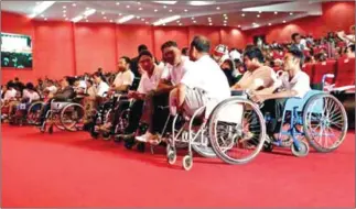  ?? HENG CHIVOAN ?? The audience at Phnom Penh’s Koh Pich Exhibition Centre waits for a speech by Prime Minister Hun Sen as part of the Day of Persons with Disabiliti­es in 2013.