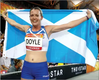  ??  ?? Team Scotland’s Eilidh Doyle poses with a Saltire after winning 400m hurdles silver for the third time in a row