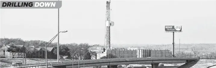  ?? Paul Moseley / Fort Worth Star-Telegram ?? A natural gas rig is seen in 2013 in southwest Arlington. The Barnett Shale in the DFW area has been seeing more frequent droughts of horizontal drilling permits.