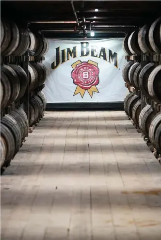  ?? Getty images File ?? STACKED: Bourbon is stored in a barrel house at the Jim Beam distillery in Clermont, Ky.