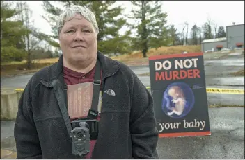  ?? AP PHOTO/ EARL NEIKIRK ?? Debra Mehaffey stands outside the Bristol Women’s Health Clinic on Thursday.