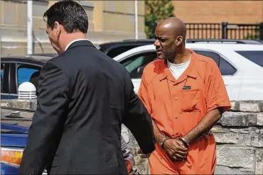  ?? DAVE ZAPOTOSKY/THE BLADE ?? The Rev. Cordell Jenkins leaves U.S. District Court on Wednesday in Toledo. A scheduled bond hearing was continued until July 6. He is charged with child sex traffickin­g.