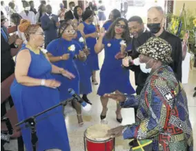  ?? (Photos: Naphtali Junior) ?? Bunny Diamond’s children share in a performanc­e by percussion­ist Bongo Herman during Thursday’s service.