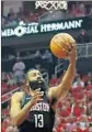  ?? Ronald Martinez Getty Images ?? JAMES HARDEN, who scored 27 points on an off shooting night, drives during the first quarter.