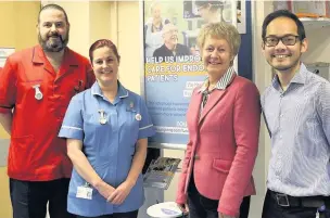  ??  ?? ●●Endoscopy nursing staff Steven and Beverley Murphy with patient Linda Carnall and Dr Colin Kong