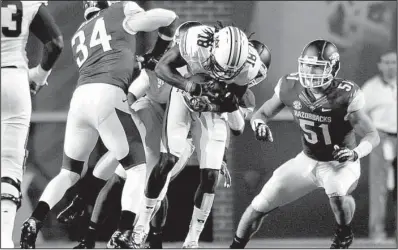  ?? NWA Media/MICHAEL WOODS ?? Arkansas linebacker Brooks Ellis (right) had been slowed by a knee injury early in fall camp but has returned and is expected to be ready for the Razorbacks’ season opener Saturday against Auburn.