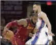  ?? TONY DEJAK — THE ASSOCIATED PRESS ?? LeBron James drives past the 76ers’ Ben Simmons during the first half.