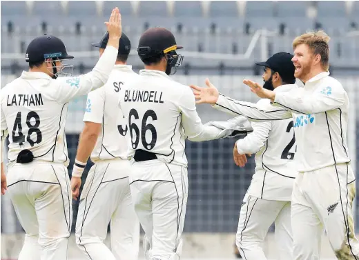  ?? Photo / AP ?? The Black Caps enjoyed early breakthrou­ghs in the Bangladesh second innings last night.